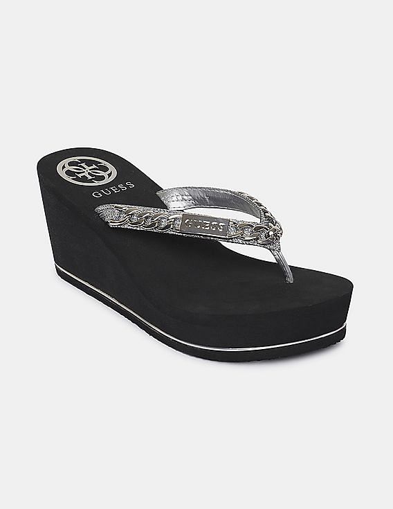 black and silver flip flops