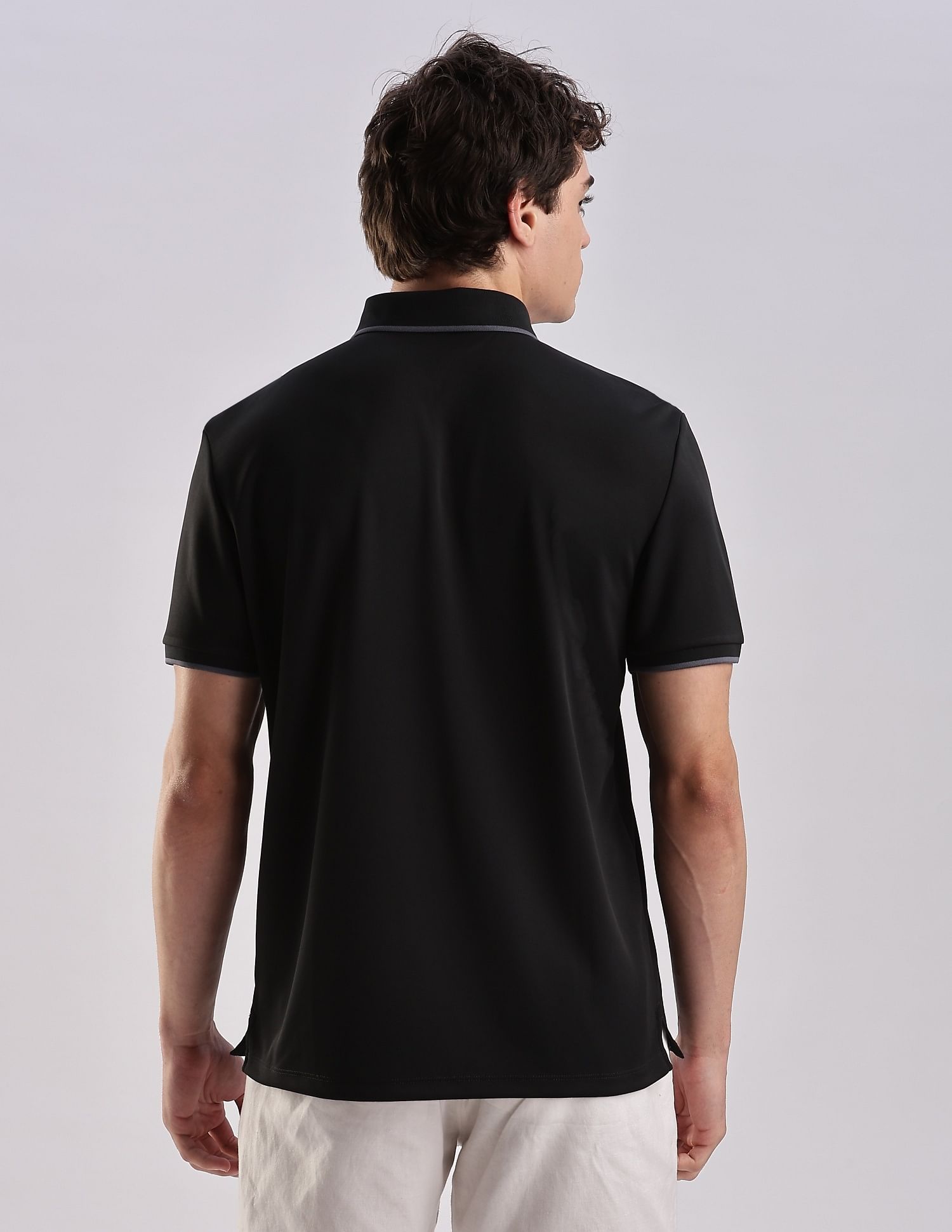 Calvin Klein Jeans Regular-Fit Solid Polyester Polo Shirt
